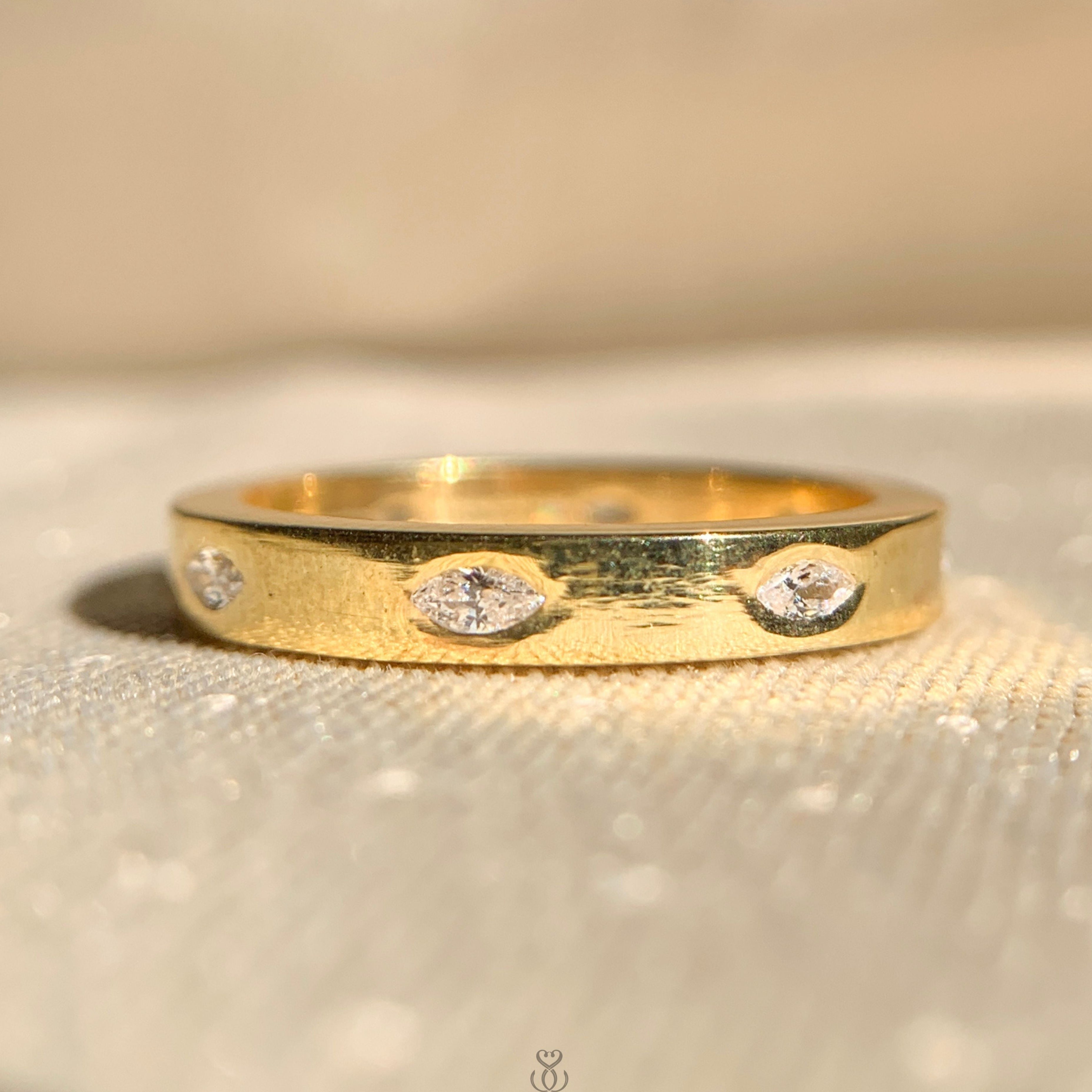 Elegant half bezel solitaire oval engagement ring in yellow gold